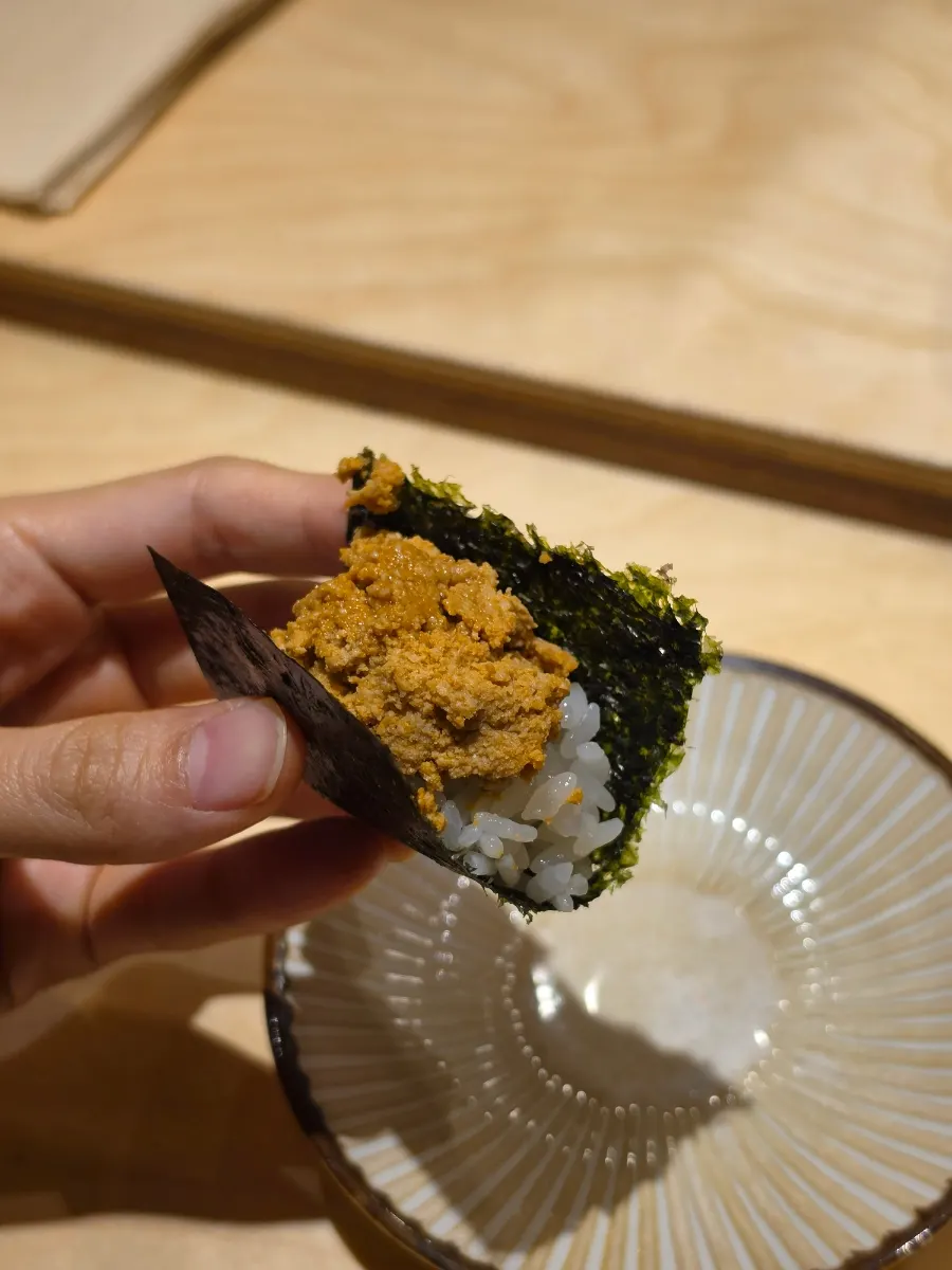 Ankimo piled with rice on seaweed