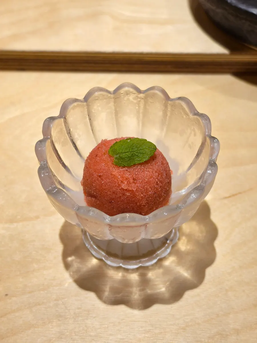 Strawberry sorbet topped with apple mint