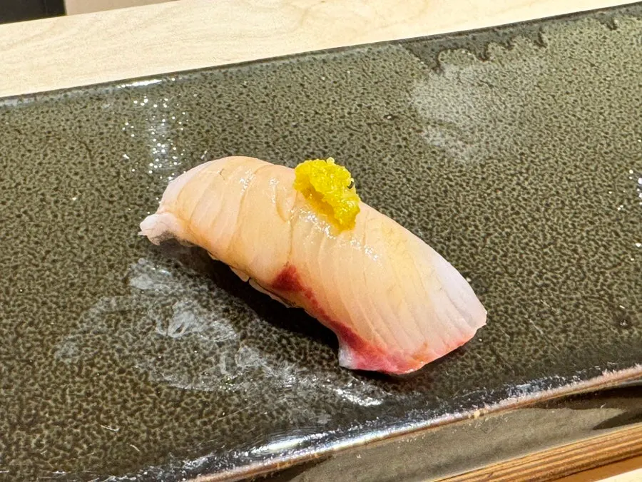 Greater amberjack nigiri topped with yuzu kosho