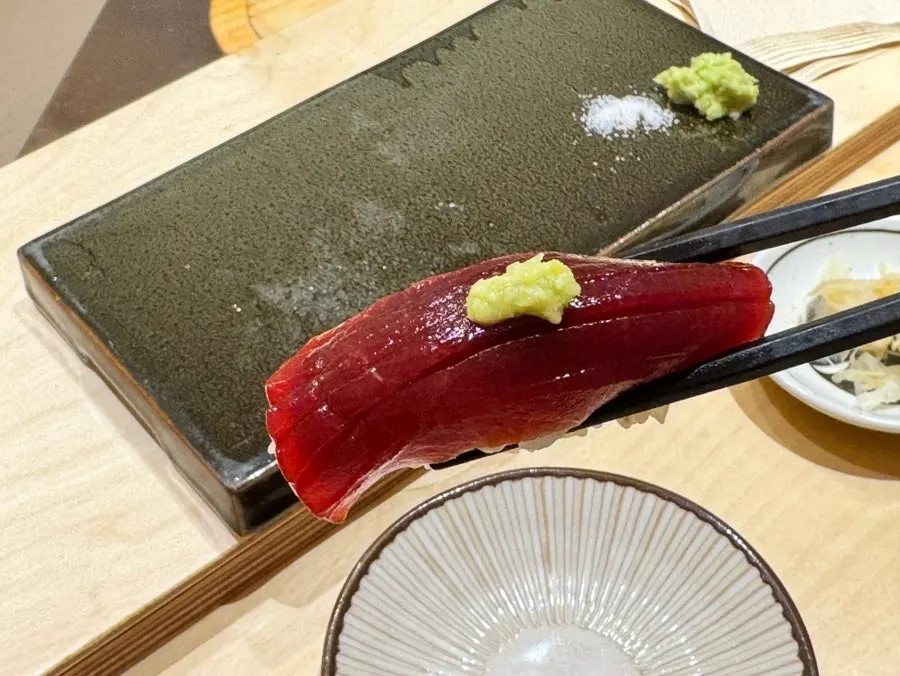 A piece of Sushi Hibi's tuna loin nigiri
