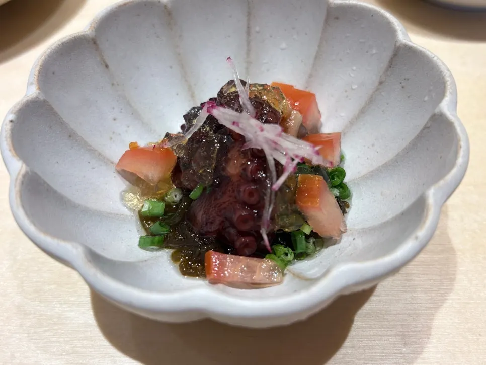 Stone octopus and seaweed salad with chives