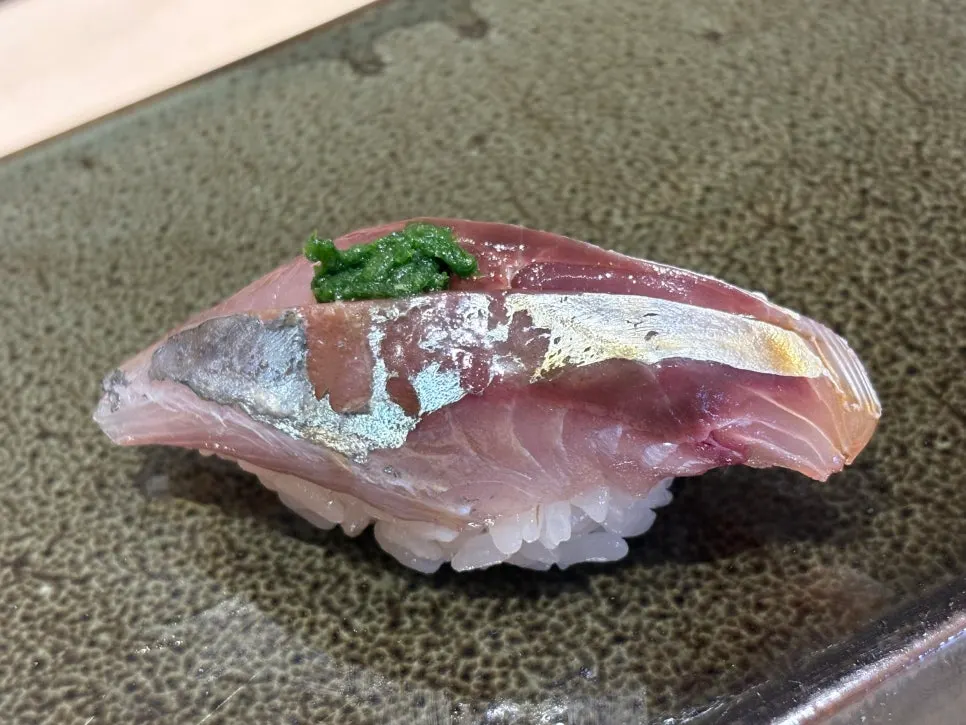 A piece of nigiri from the omakase course