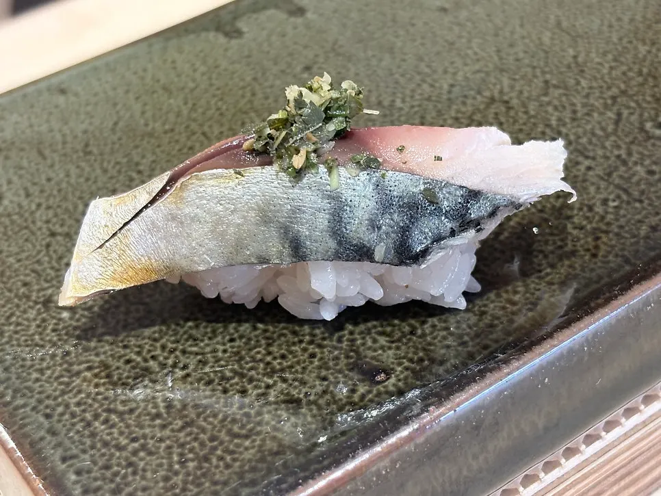 A piece of nigiri midway through the omakase