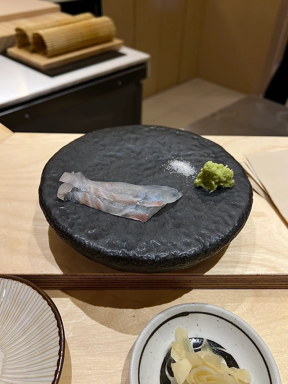 Two pieces of flounder sashimi at Sushi Hibi