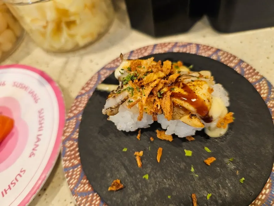 Plate of cheese conch sushi and eel sushi