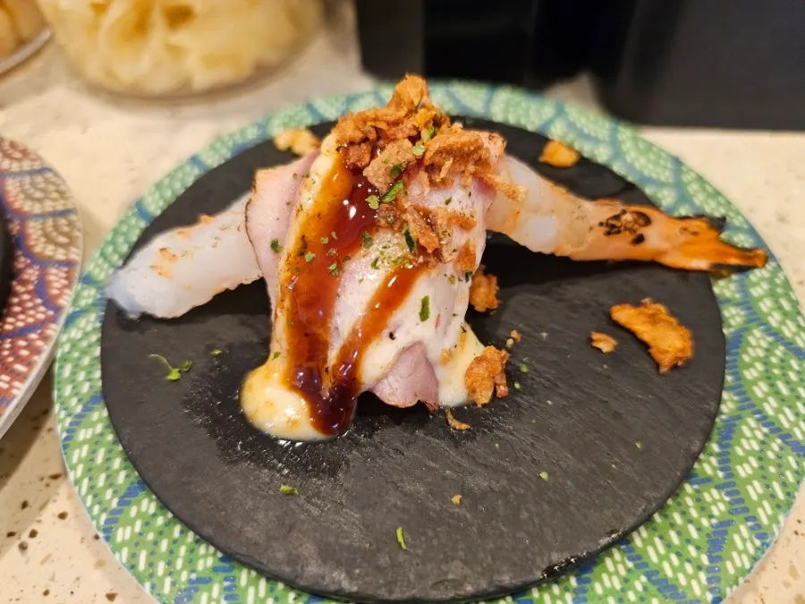 A plate of egg shrimp sushi