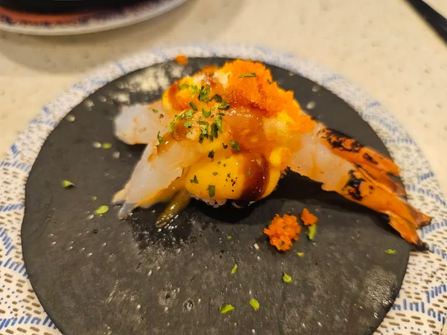 Another round of flying fish roe scallop sushi