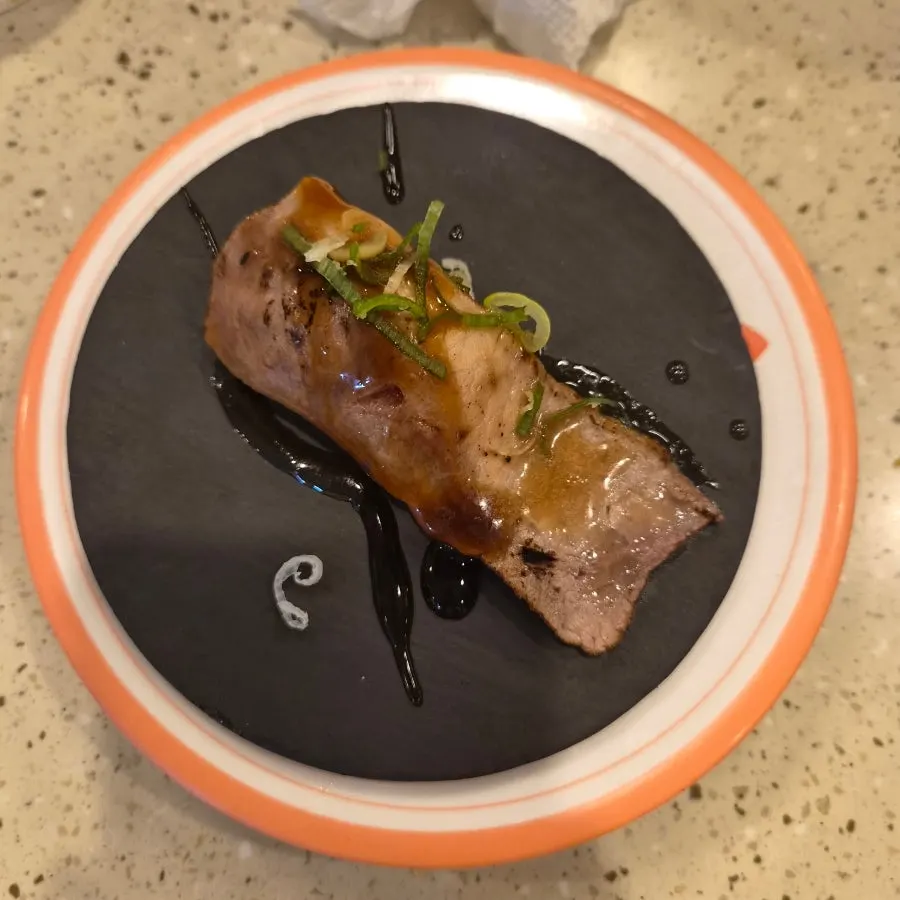 A plate of sushi picked from the rail
