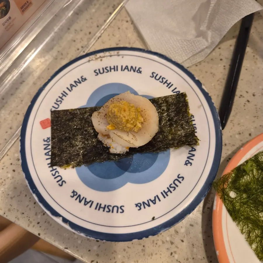 Two plates of sushi on the table