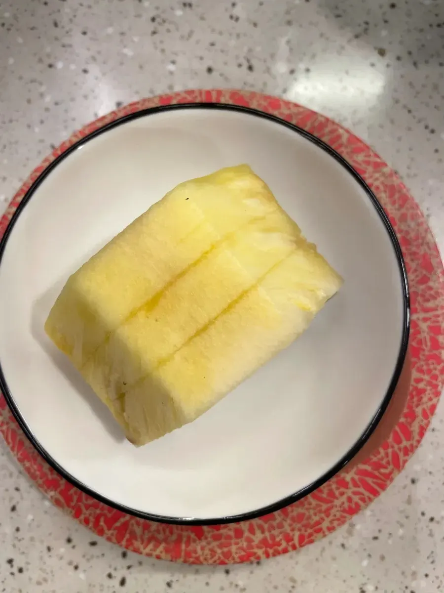 Plate of pineapple eaten to finish the meal