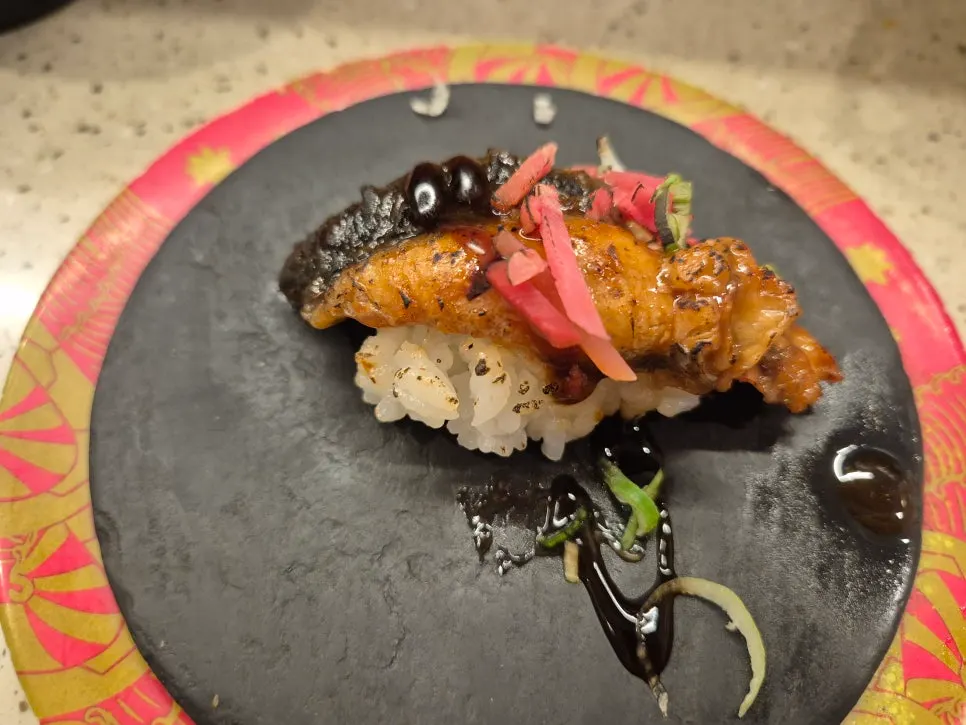 A plate of thick-cut salmon nigiri