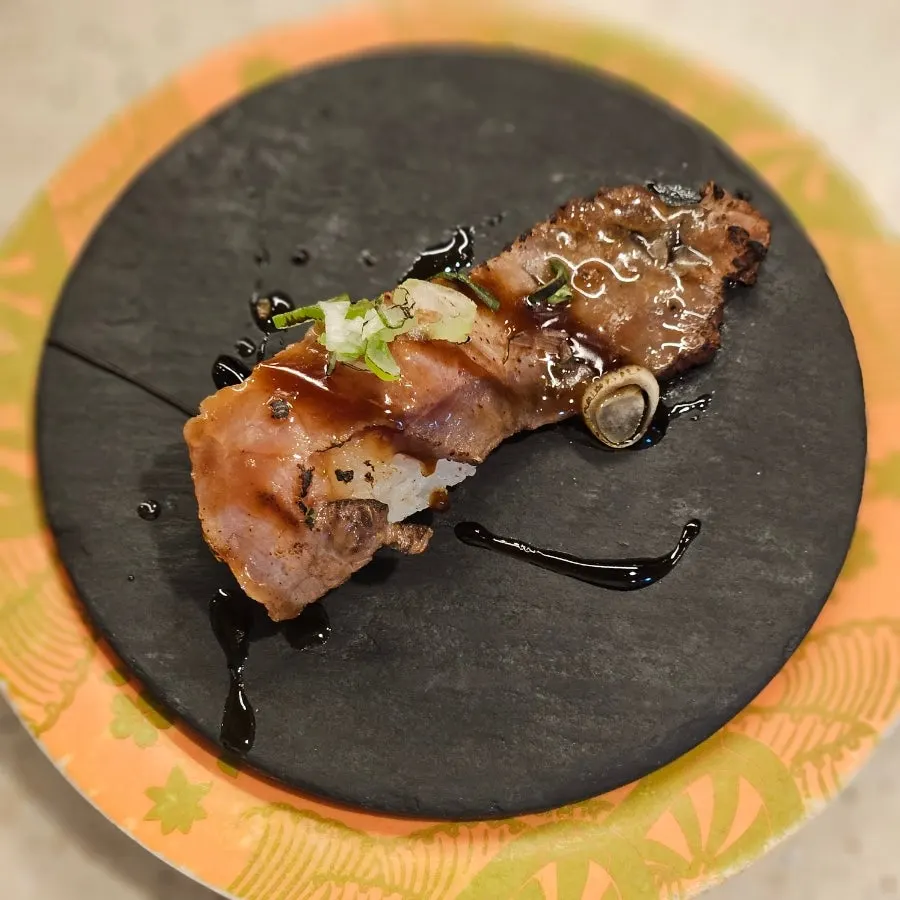 A plate of beef tartare tataki sushi