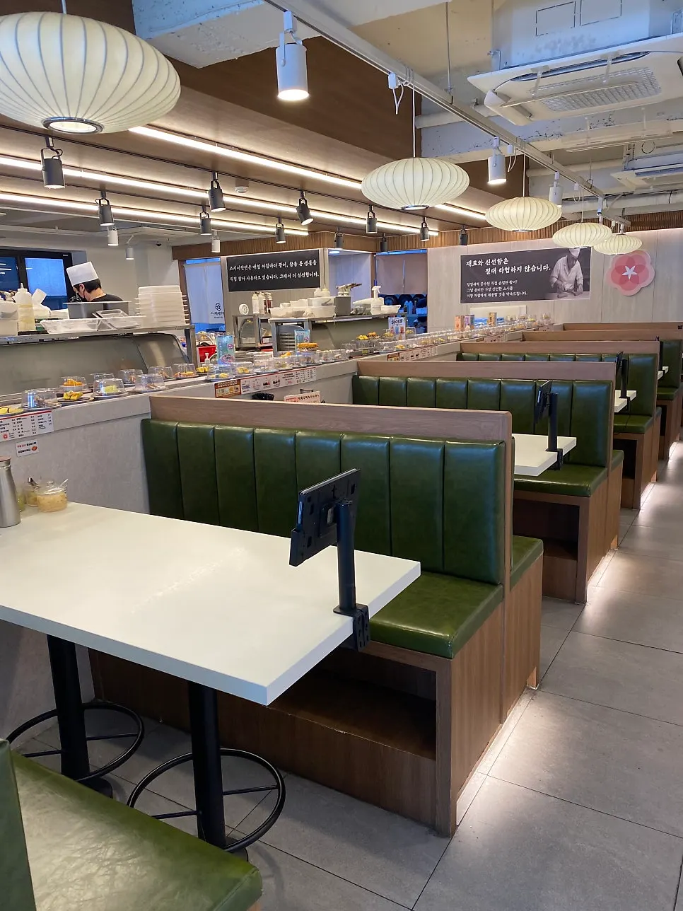 Restaurant interior with mostly 2-seat and 4-seat tables