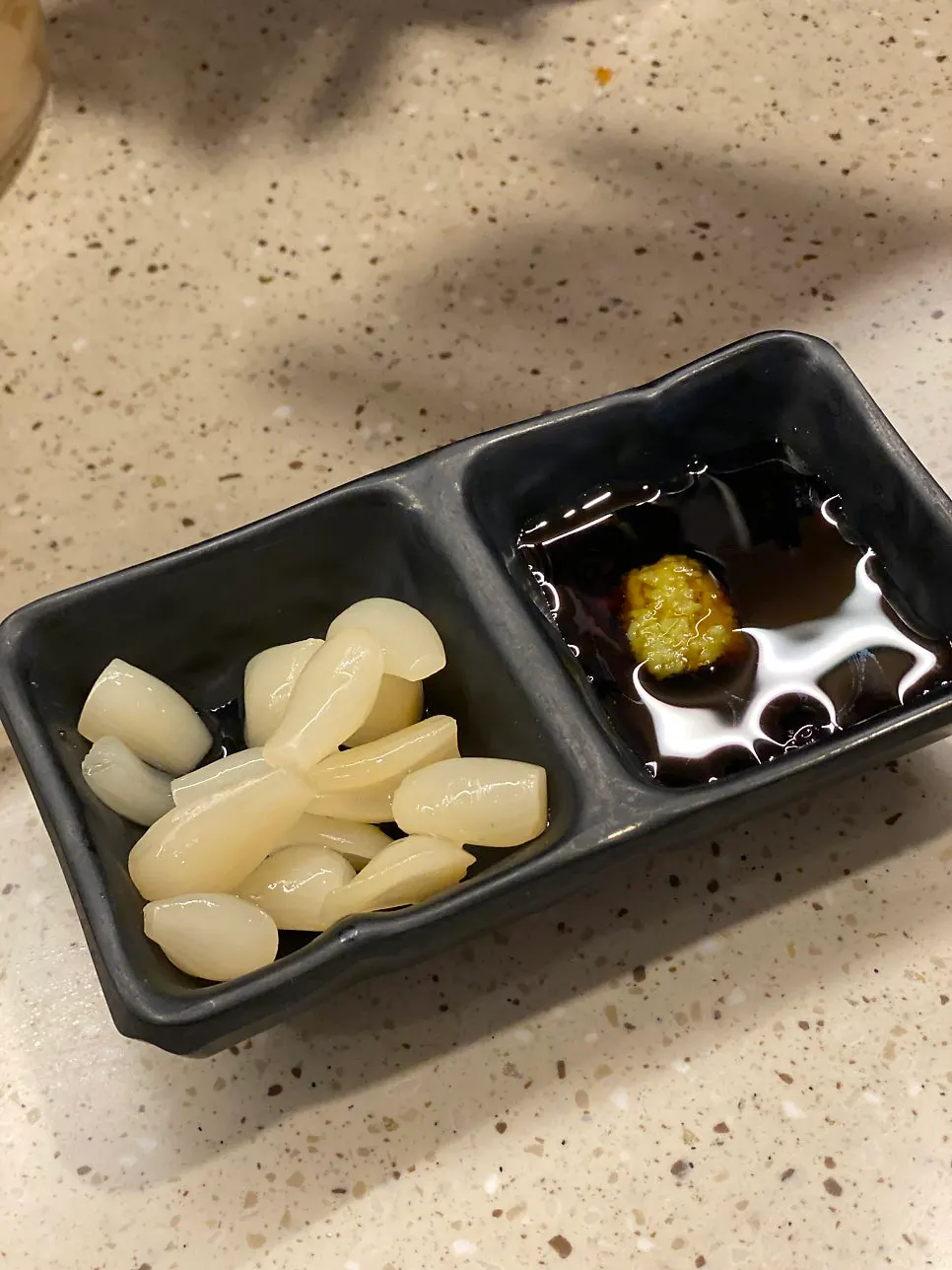 Table setting with wasabi, soy sauce, and other condiments