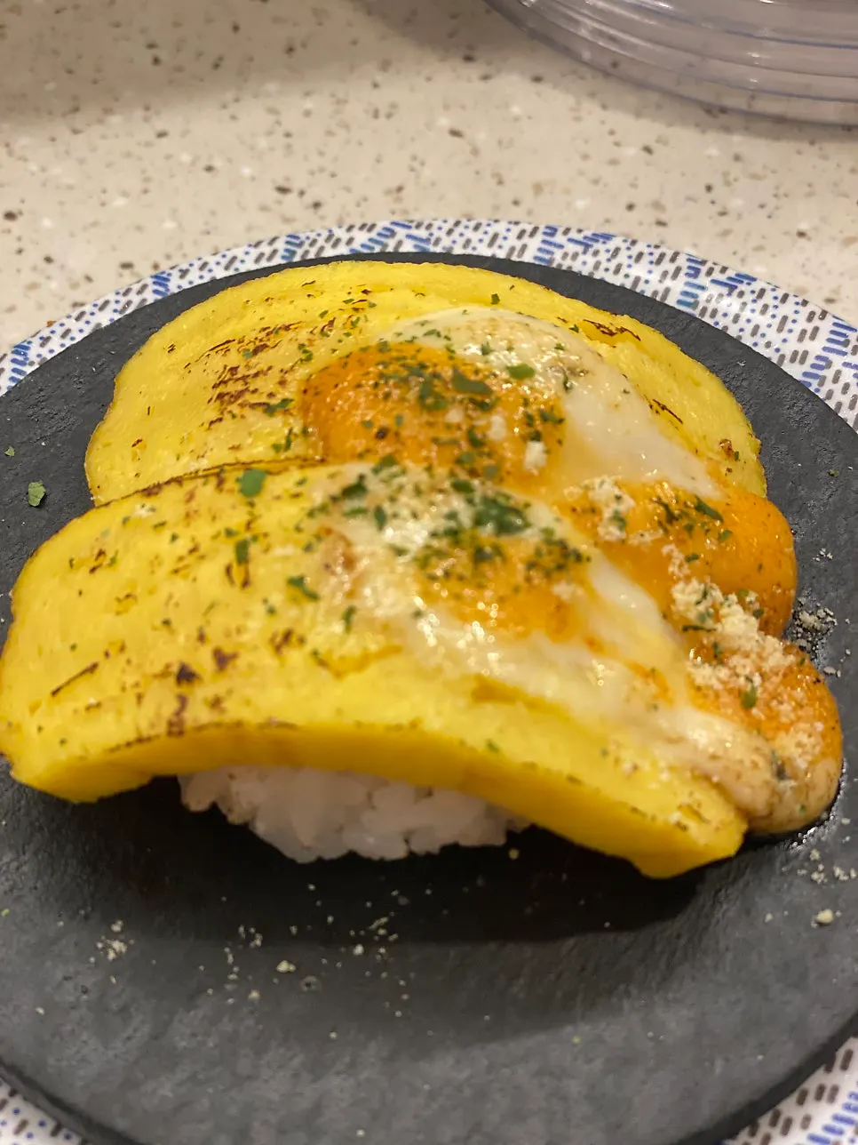 A plate of egg cheese sushi