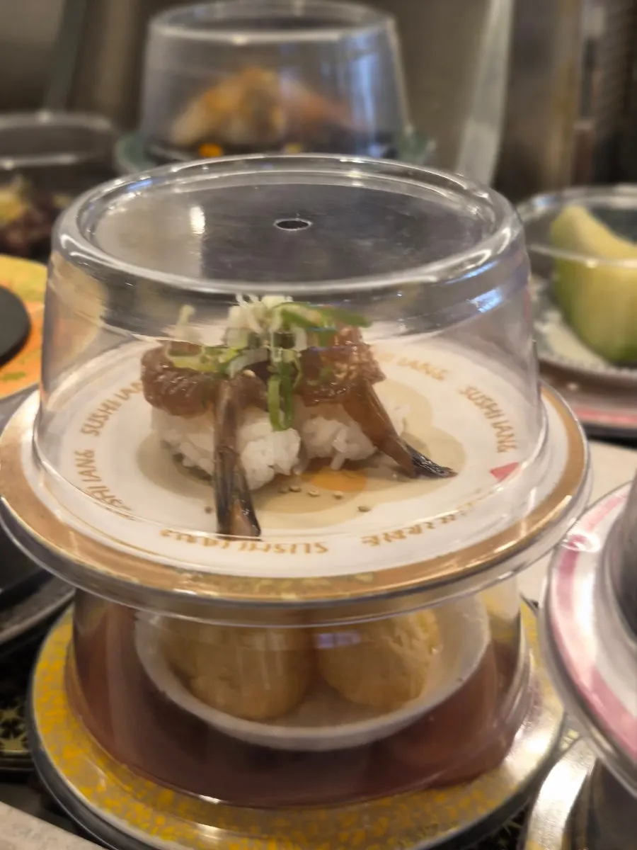 Plates of hand-picked conveyor-belt sushi