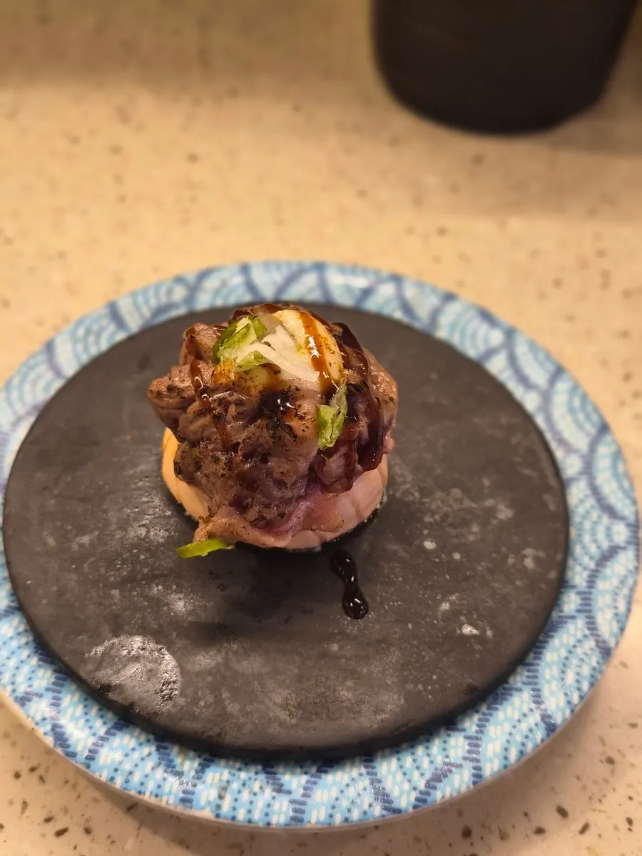 Salmon sushi with a thick slice of salmon on top