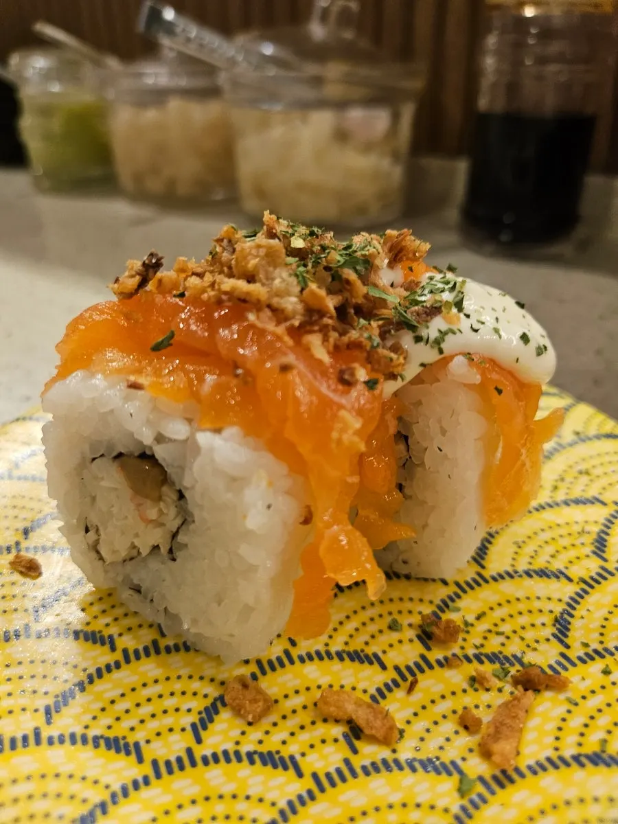 Plate of salmon nigiri and salmon onion nigiri