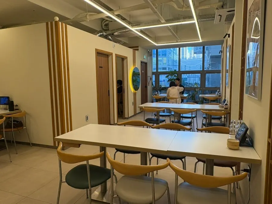 The wood-toned interior and table seating