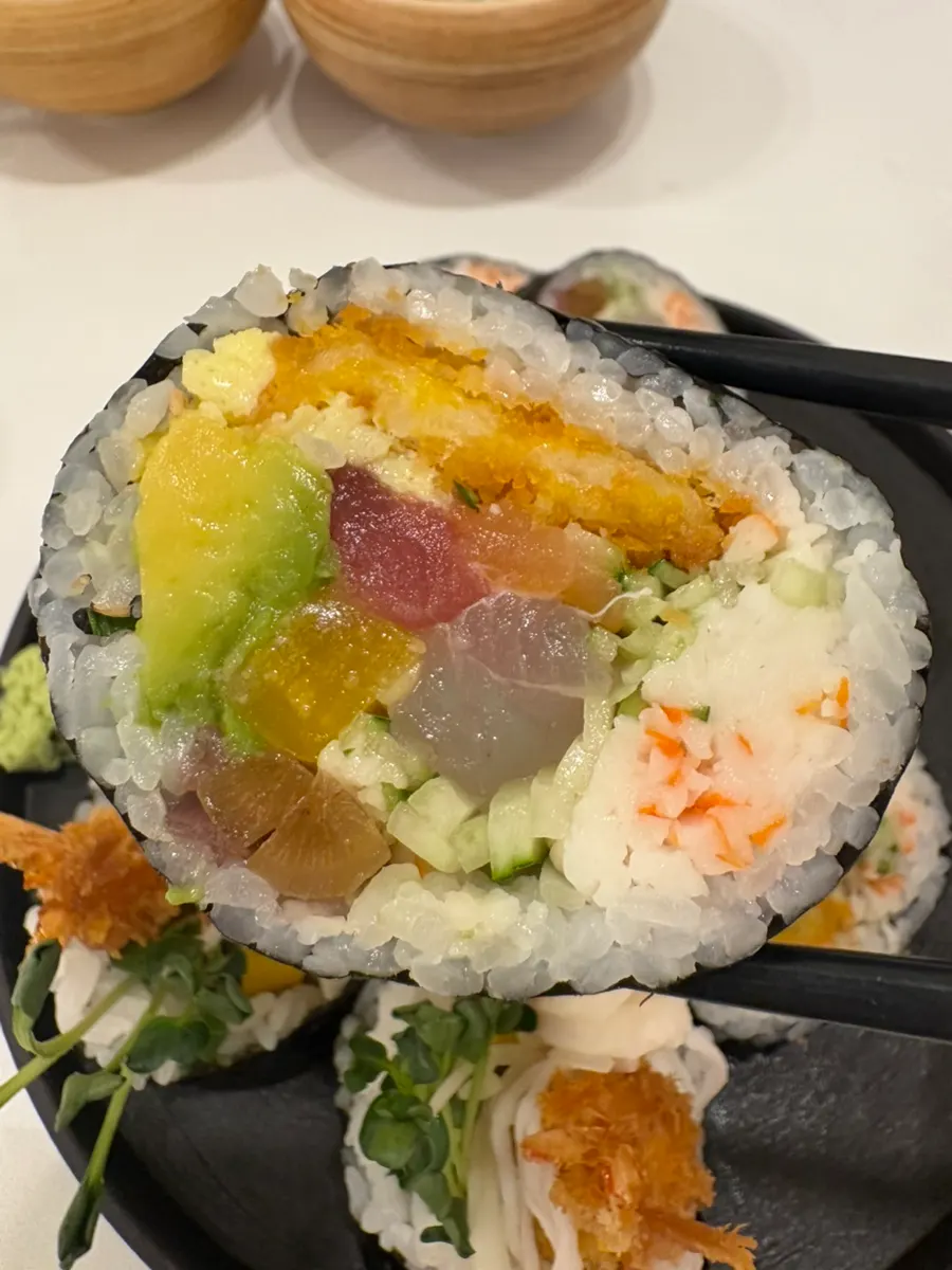 A cross-section of futomaki packed with fillings