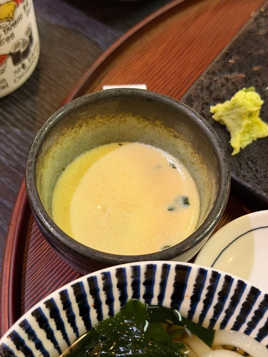 Side dishes of steamed egg and salad