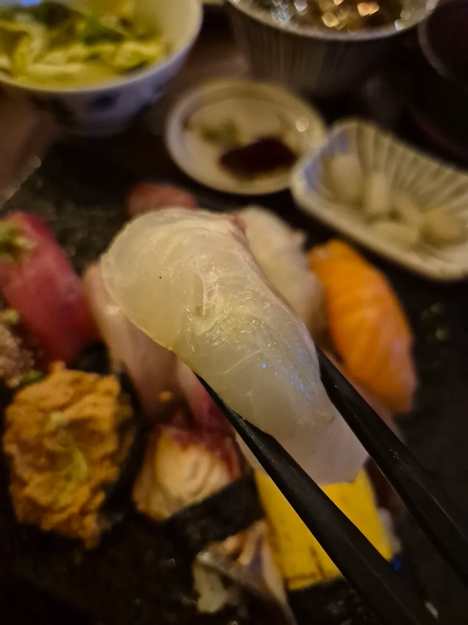 Picking up a piece of sushi from the Hap Sushi Set