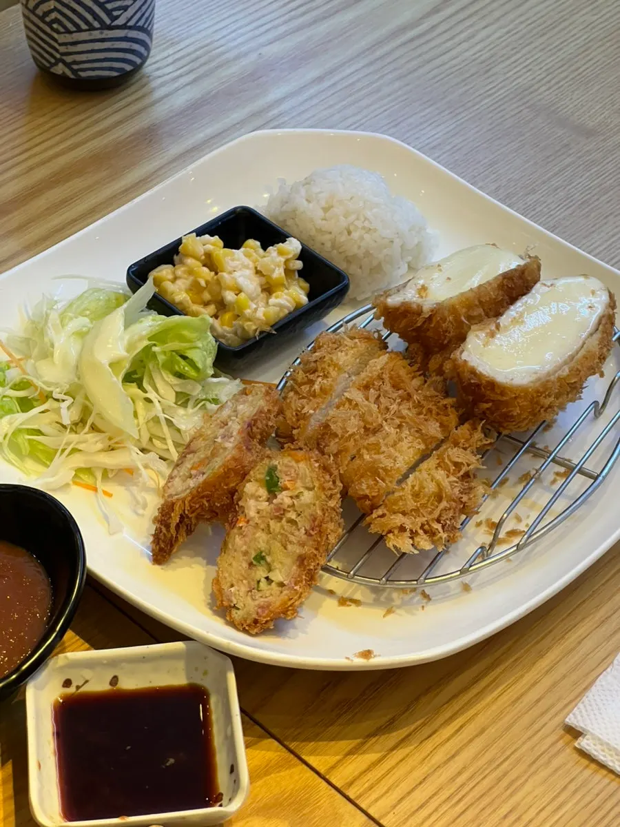Close-up of sushi topped with generous cuts of fish