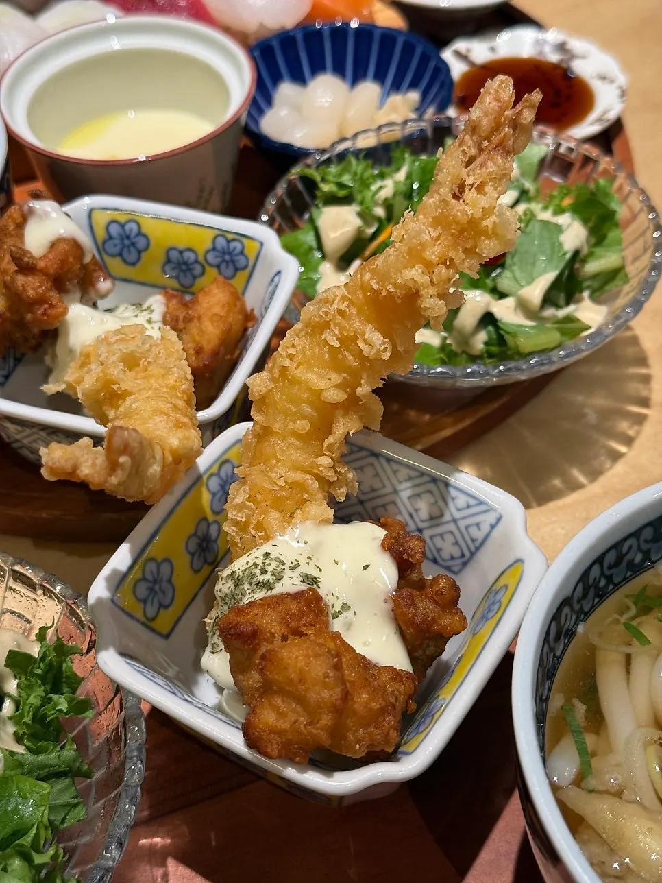 Full spread of side dishes from the premium sushi set