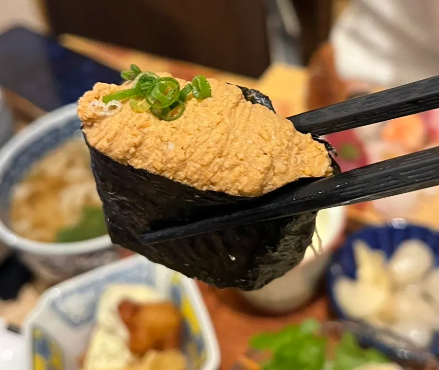 Sushi topped with white fish, tuna, and eel