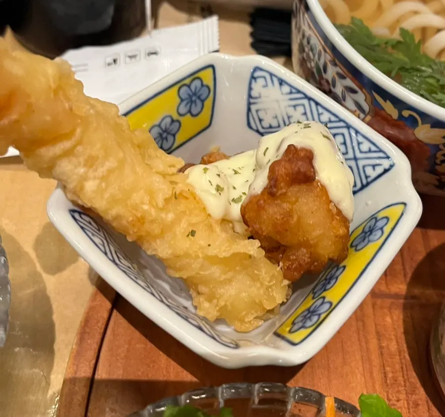 Picking up a piece of sushi from the premium set