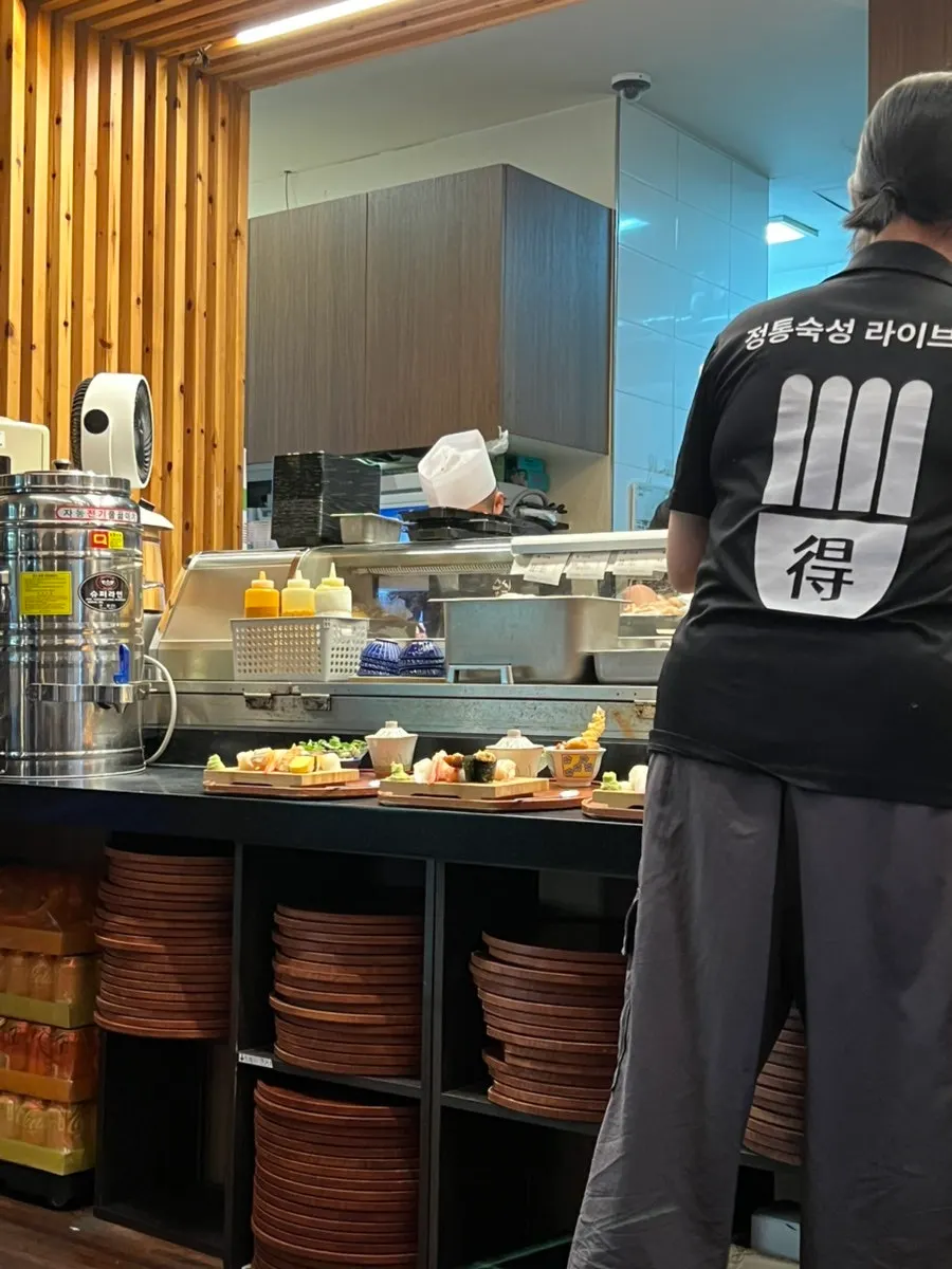 Open kitchen where cooking is visible