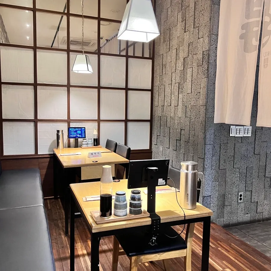 Widely spaced tables in the main hall of Sushi Doku The Songdo