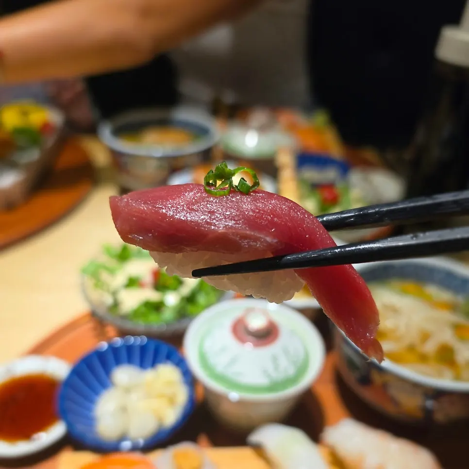 Sushi plate topped with fresh raw fish