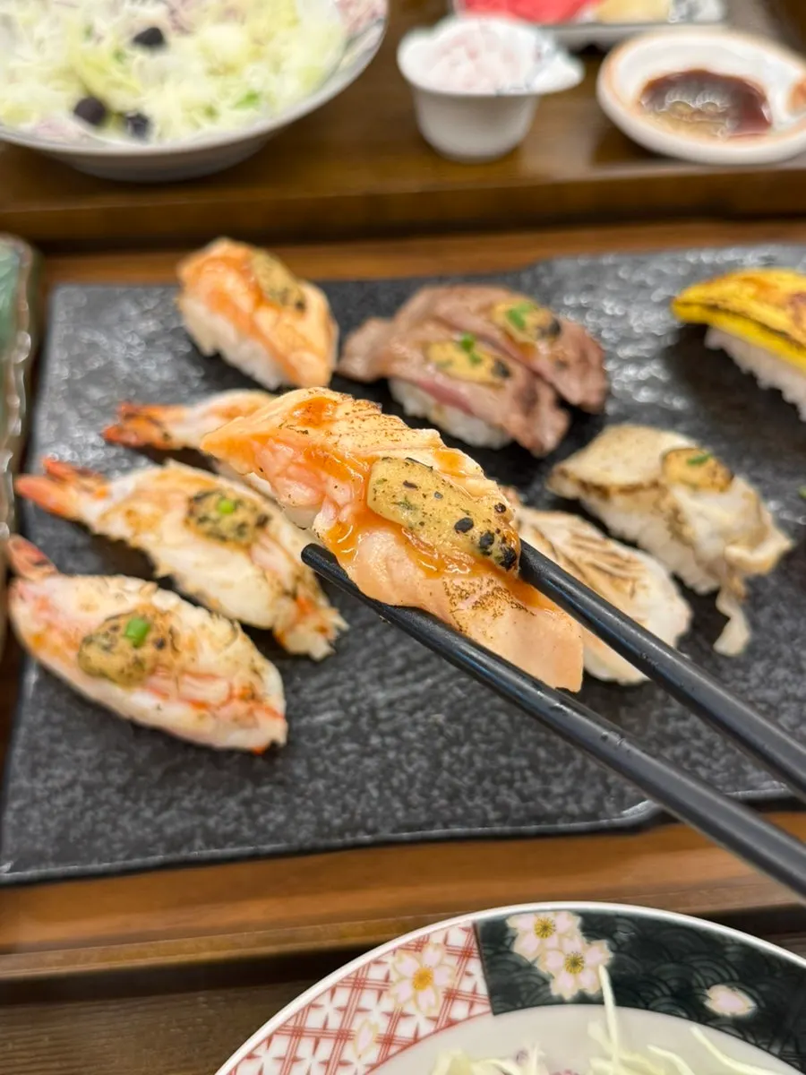 A plate of sushi arranged by type