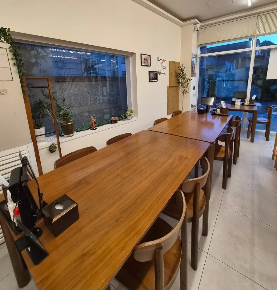 Sushi Hwa's dining hall seating divided by wood partitions