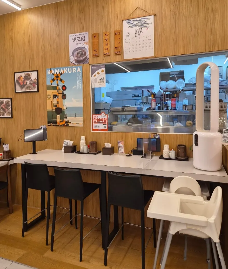Sushi Hwa's bar table set in front of the open kitchen