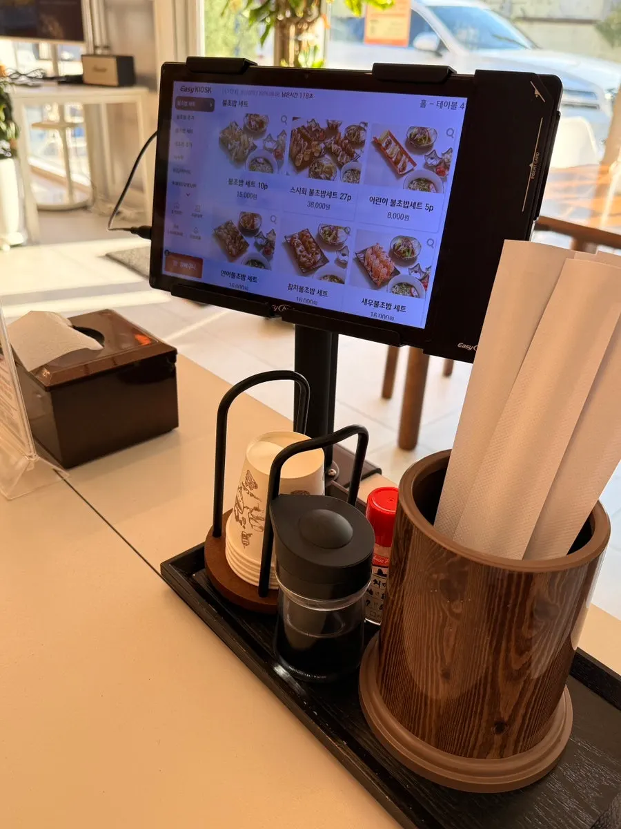 Ordering the flame-seared sushi set on the tablet