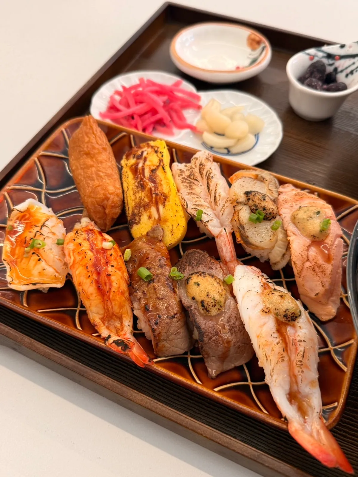 A plate of Sushi Hwa's torch-seared flame sushi
