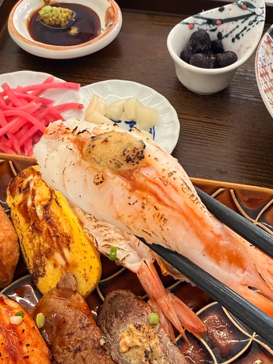 Flame-seared salmon sushi with a topping