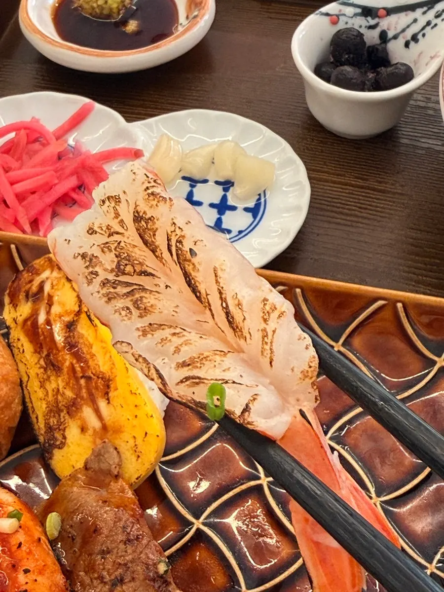 Flame-seared scallop sushi