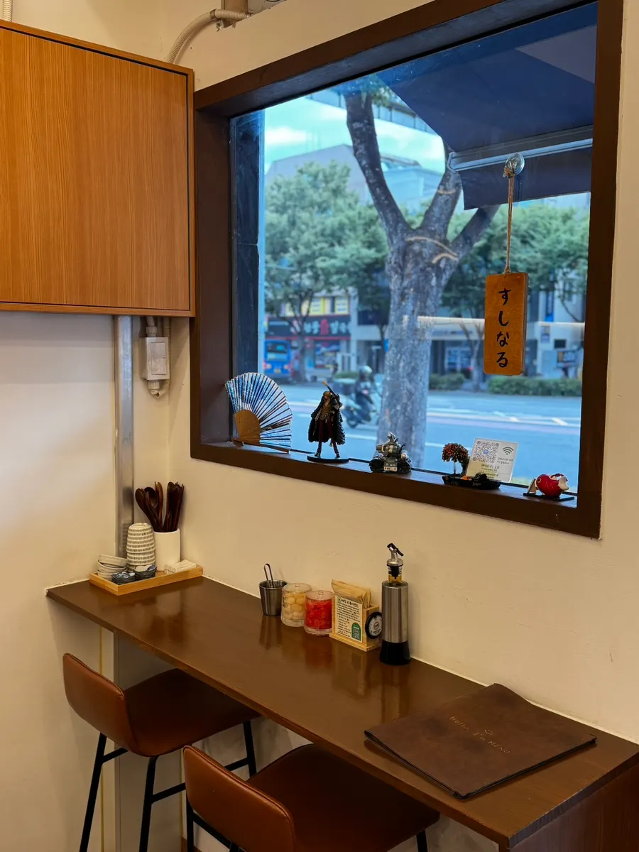 Two window bar seats decorated with figurines