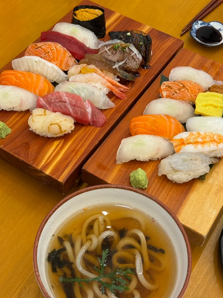 Two sushi platters laid out on the table
