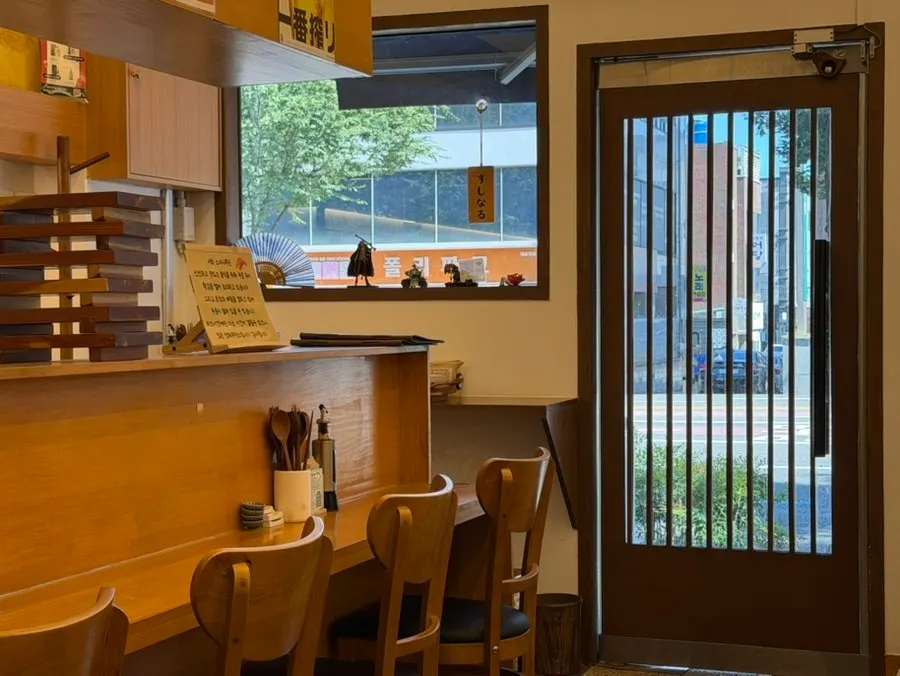 Interior of Sushi Naru with a long bar counter