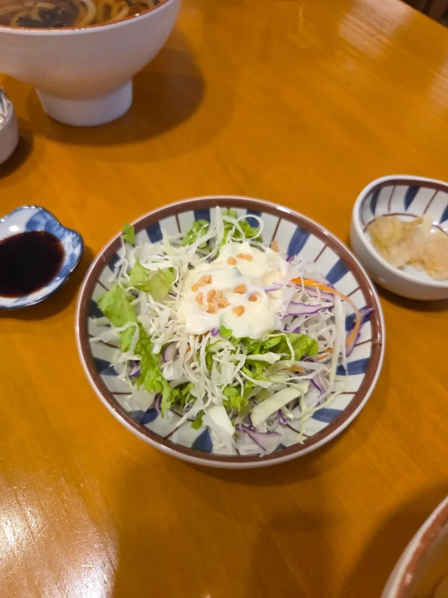 Table setting with udon served alongside sushi