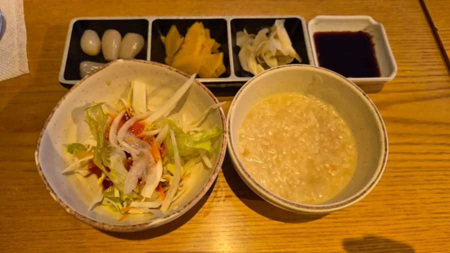 Warm porridge and bibim noodles served before the meal