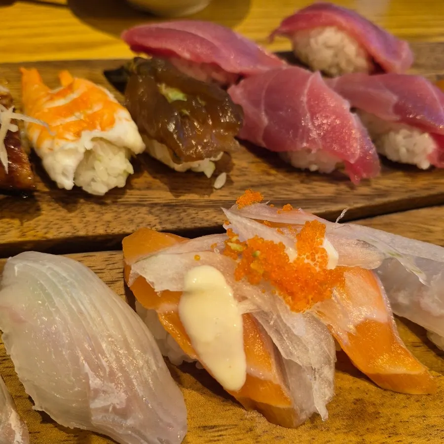 Close-up of soy sauce shrimp and salmon sushi