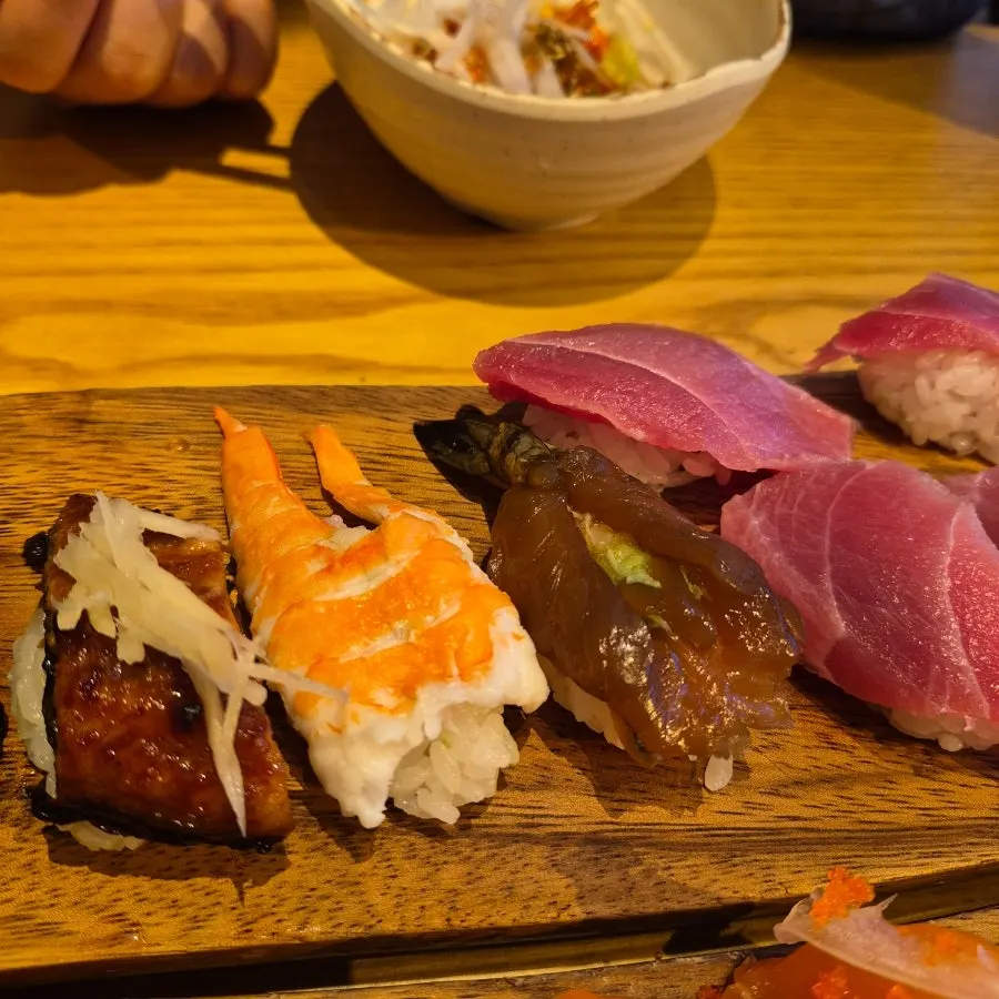 Table setting with special sushi for two and side dishes