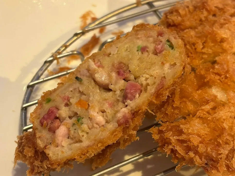 Cross-section of ball cutlet filled with vegetables and meat