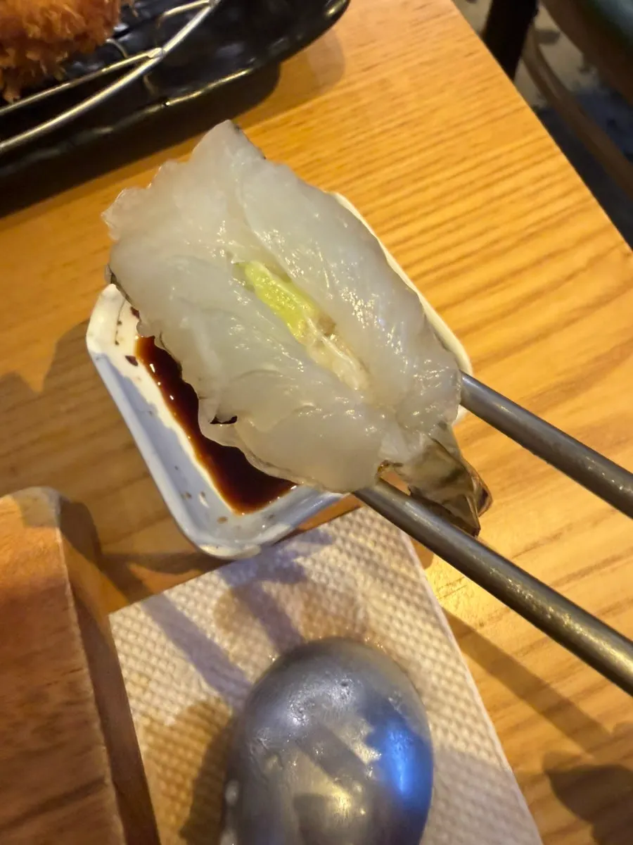 A thick piece of tuna sushi