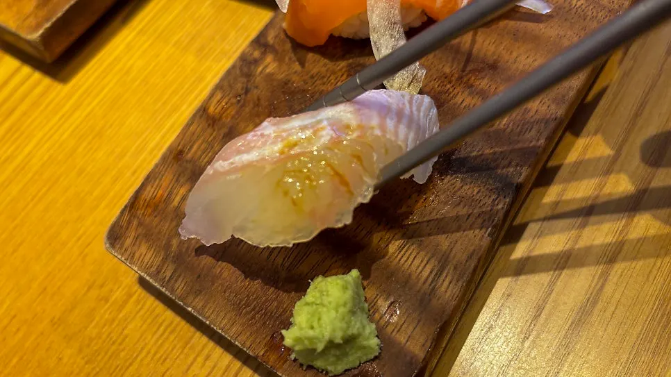 Salmon sushi topped with flying fish roe